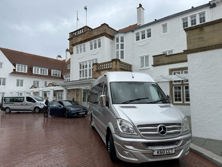Silver Mercedes Sprinter at a luxury Scottish hotel