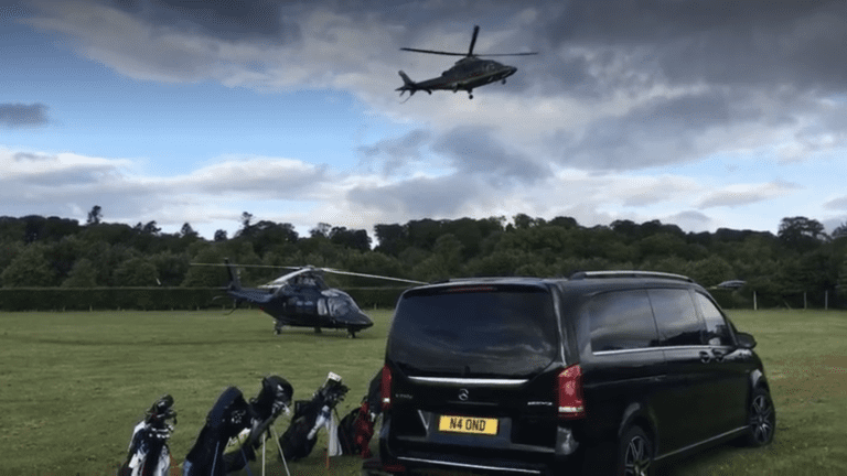 Mercedes V-Class beside arriving helicopters at a Scottish golf estate